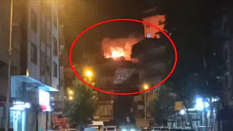 Yenişehir'deki 4 katlı binanın çatısında gece vakti çıkan yangın paniğe yol açtı